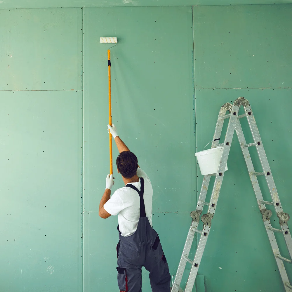 commercial painter wearing fade resistant work uniform
