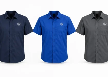 Custom commercial cleaning uniforms in navy blue, royal blue, and charcoal
